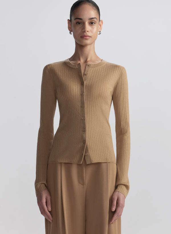 woman wearing tan cardigan and tan pants