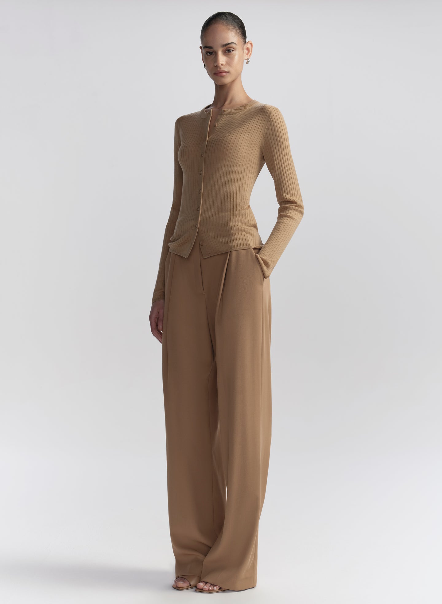 woman wearing tan cardigan and tan pants