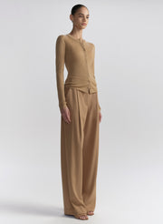 woman wearing tan cardigan and tan pants