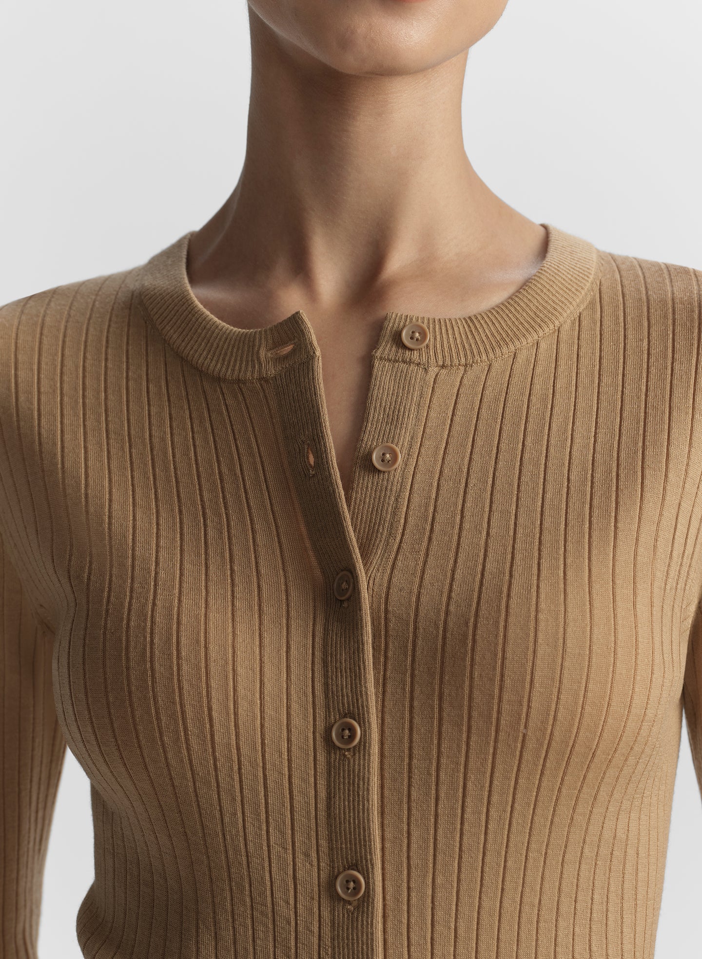 woman wearing tan cardigan and tan pants