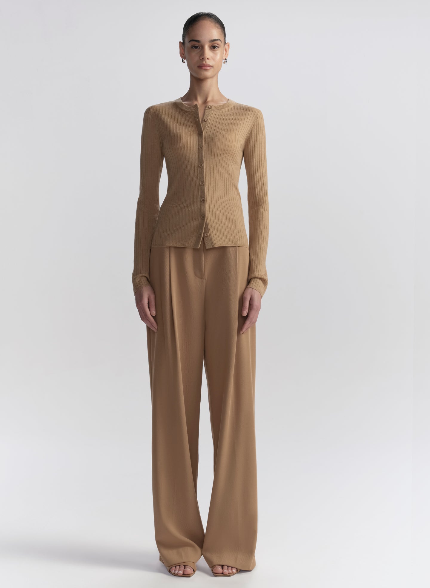 woman wearing tan cardigan and tan pants