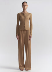 woman wearing tan cardigan and tan pants