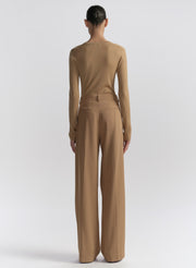 woman wearing tan cardigan and tan pants