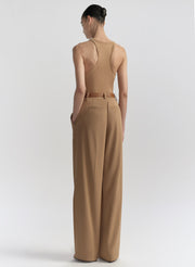 woman wearing tan tank top and matching trousers 