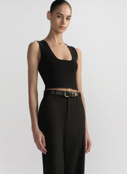 woman wearing black tank top and black pants