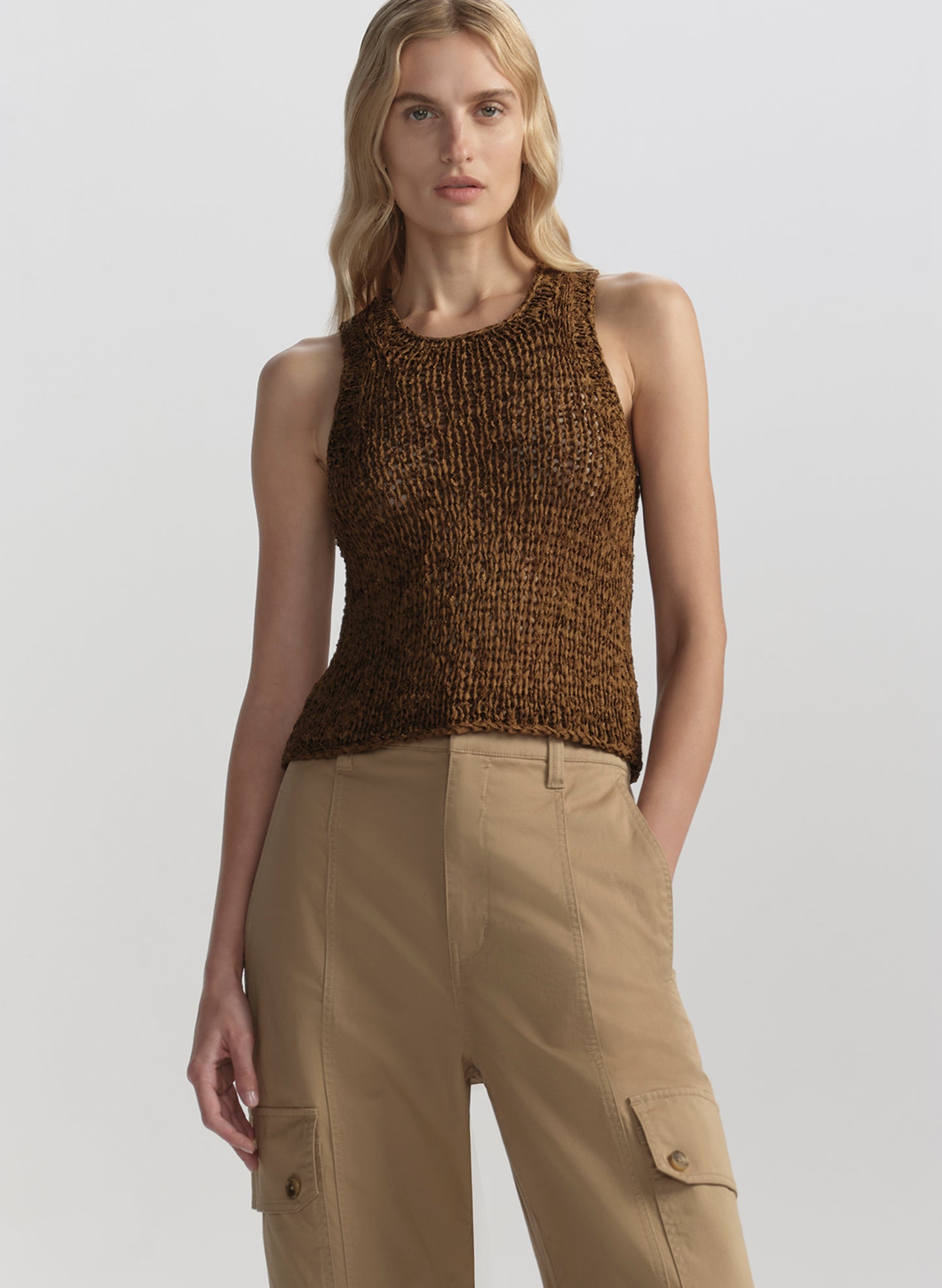 woman wearing brown tank top and tan cargo pants