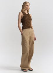 woman wearing brown tank top and tan cargo pants