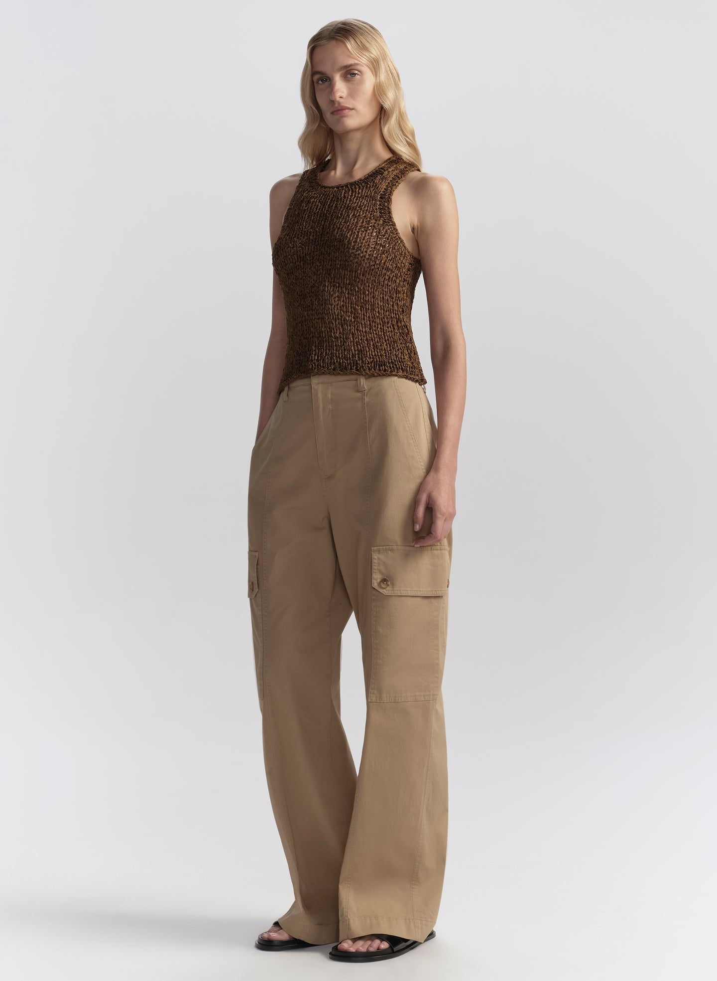 woman wearing brown tank top and tan cargo pants