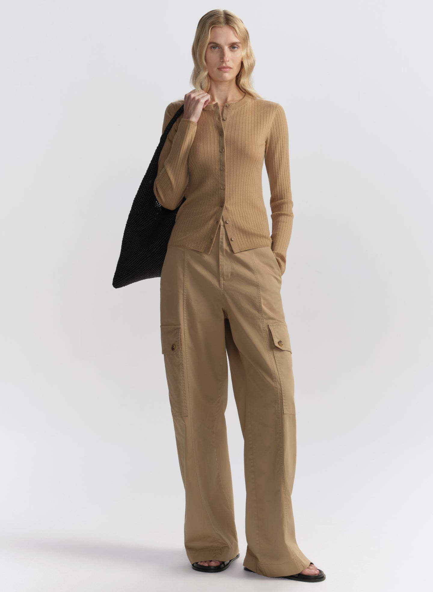 woman wearing tan cardigan and tan cargo pants