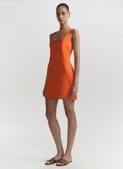 woman wearing orange mini dress