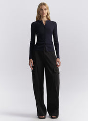 woman wearing navy blue cardigan and navy blue cargo pants