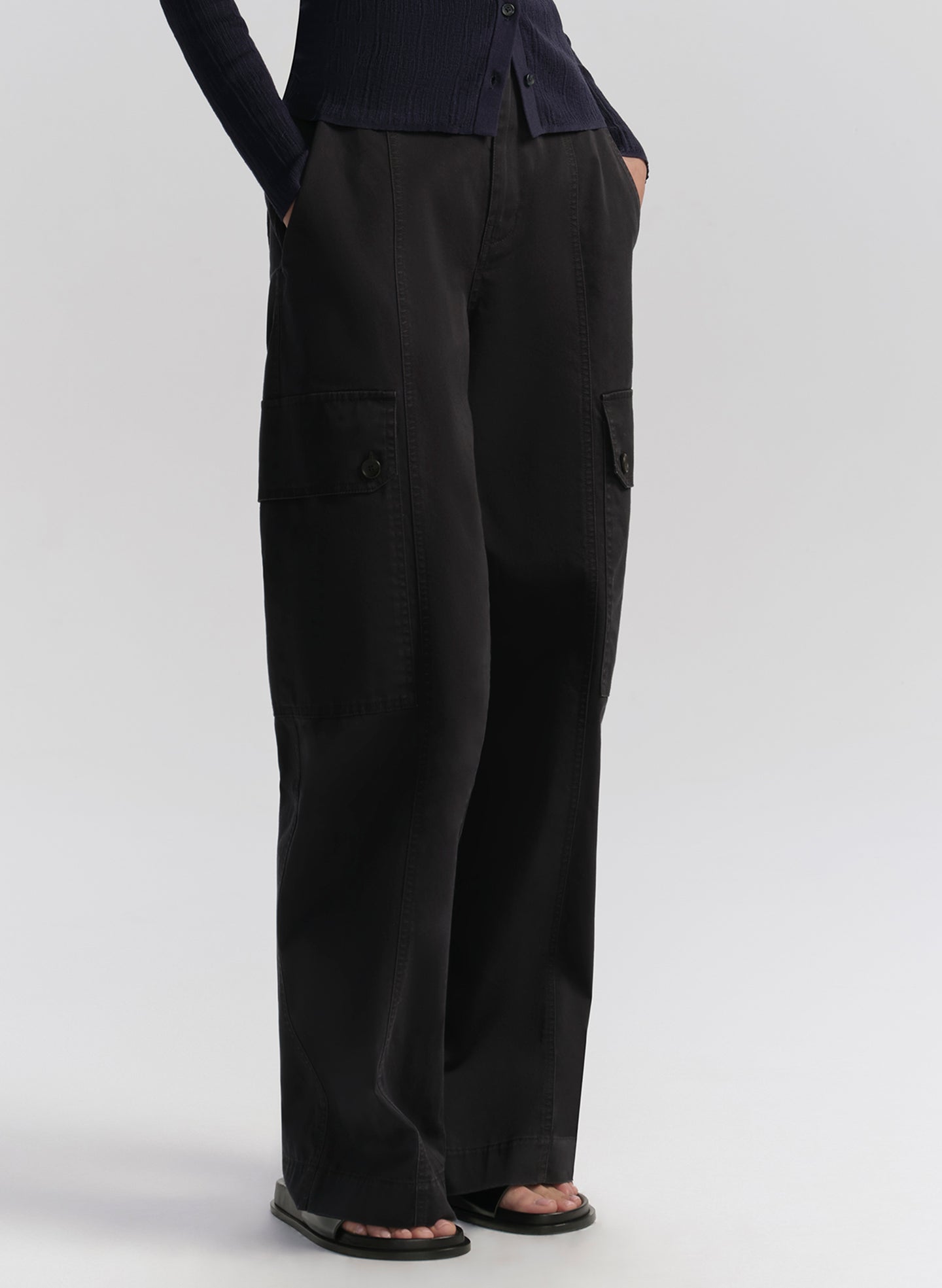woman wearing navy blue cardigan and navy blue cargo pants