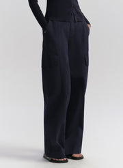 woman wearing navy blue cardigan and matching navy blue cardigan