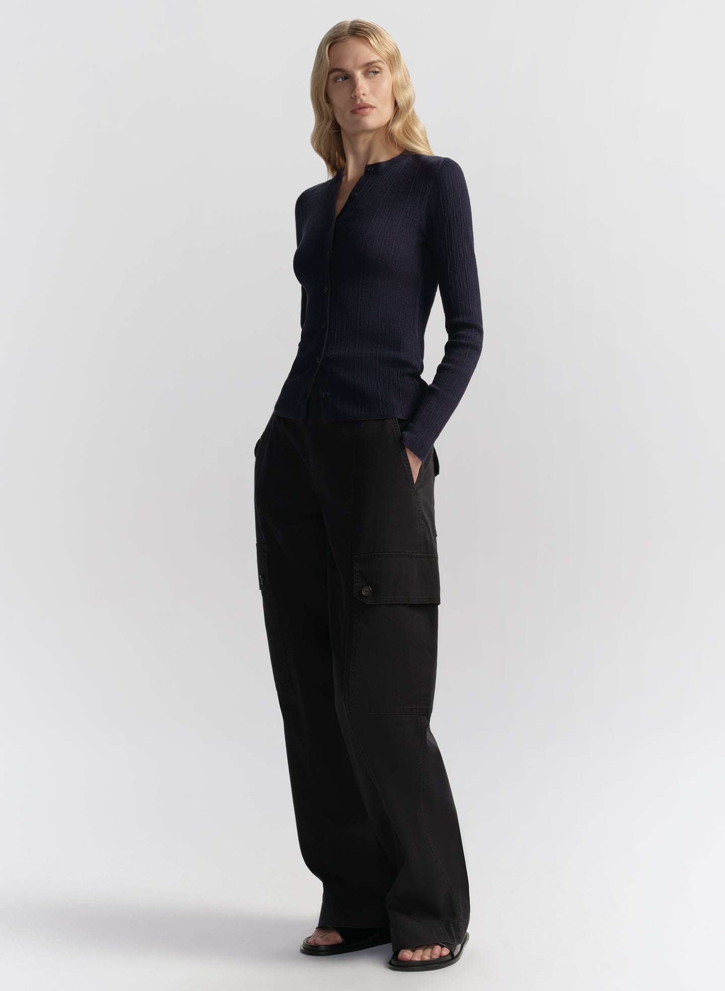 woman wearing navy blue cardigan and navy blue cargo pants