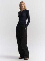 woman wearing navy blue cardigan and navy blue cargo pants