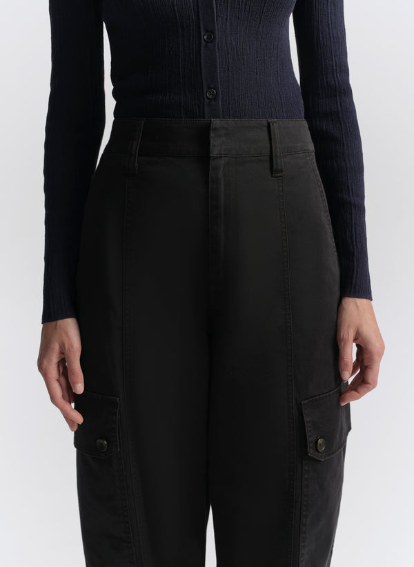 woman wearing navy blue cardigan and navy blue cargo pants