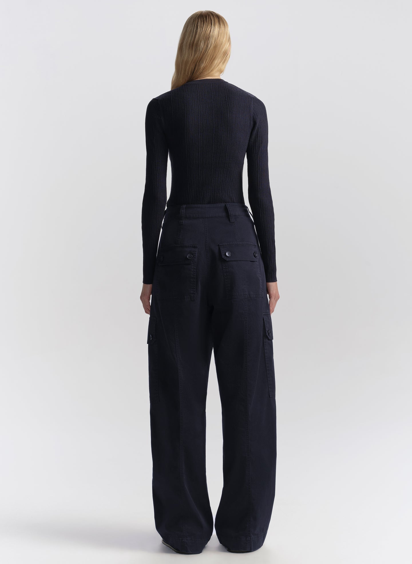 woman wearing navy blue cardigan and matching navy blue cardigan