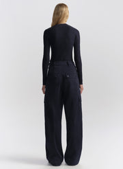 woman wearing navy blue cardigan and matching navy blue cardigan