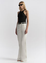 woman wearing black tank top and white denim jeans