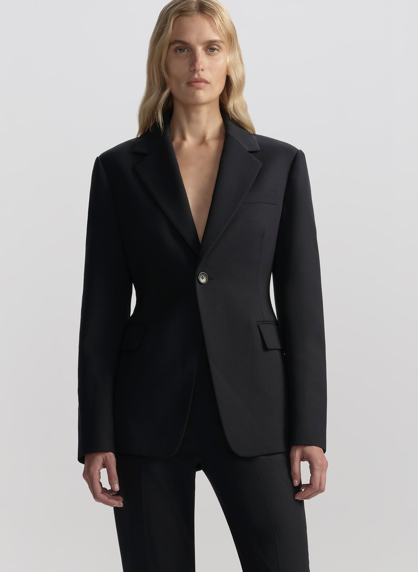 woman wearing navy blue suit
