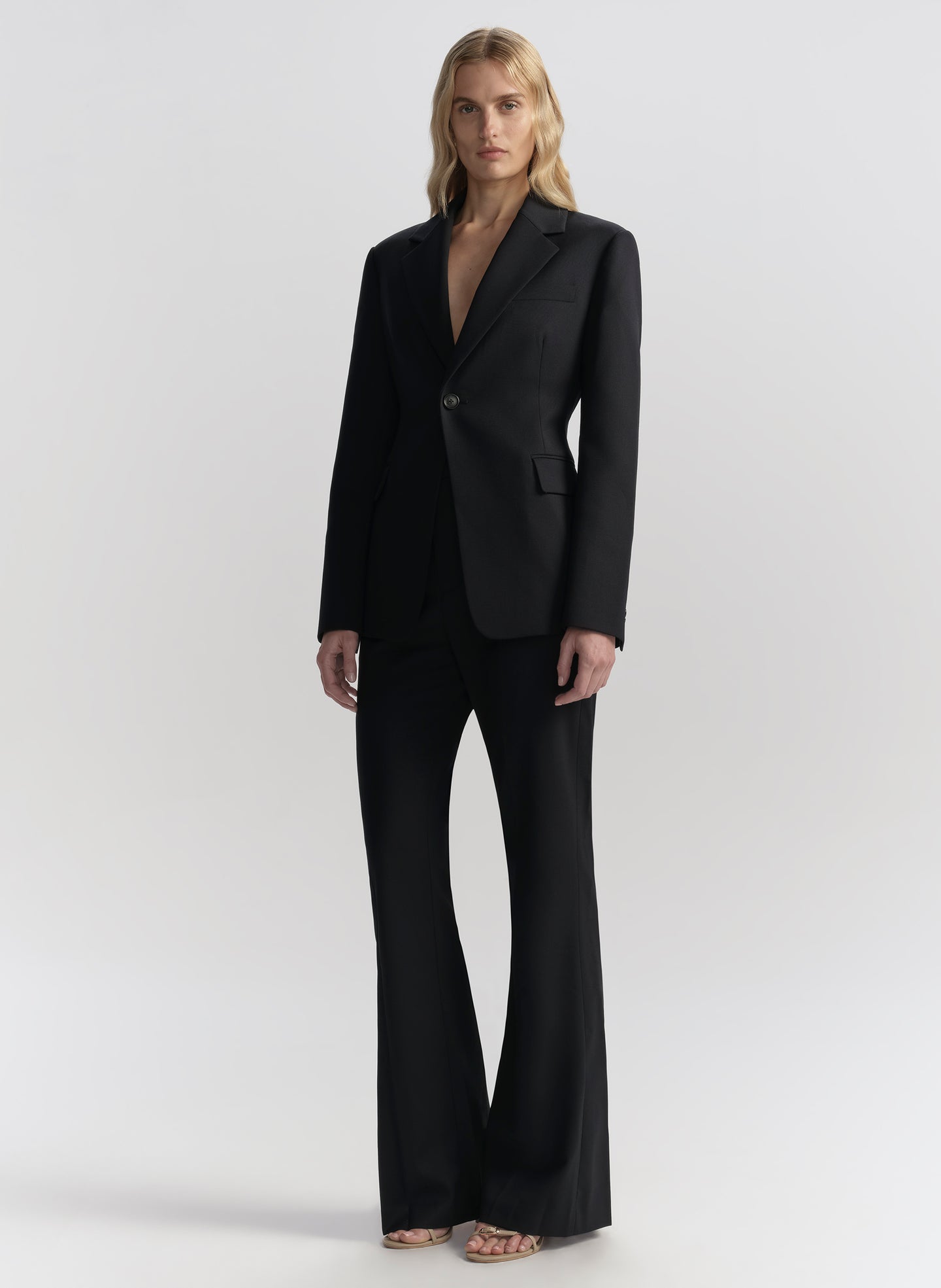 woman wearing navy blue suit