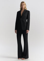 woman wearing navy blue suit