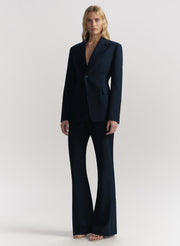 Woman wearing a blue suit on a white background