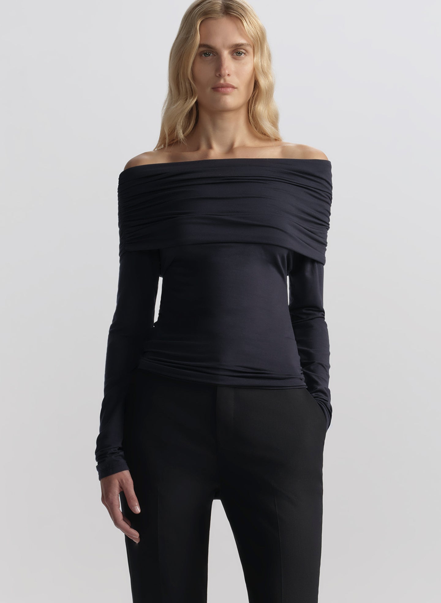 woman wearing blue off shoulder tee and pants
