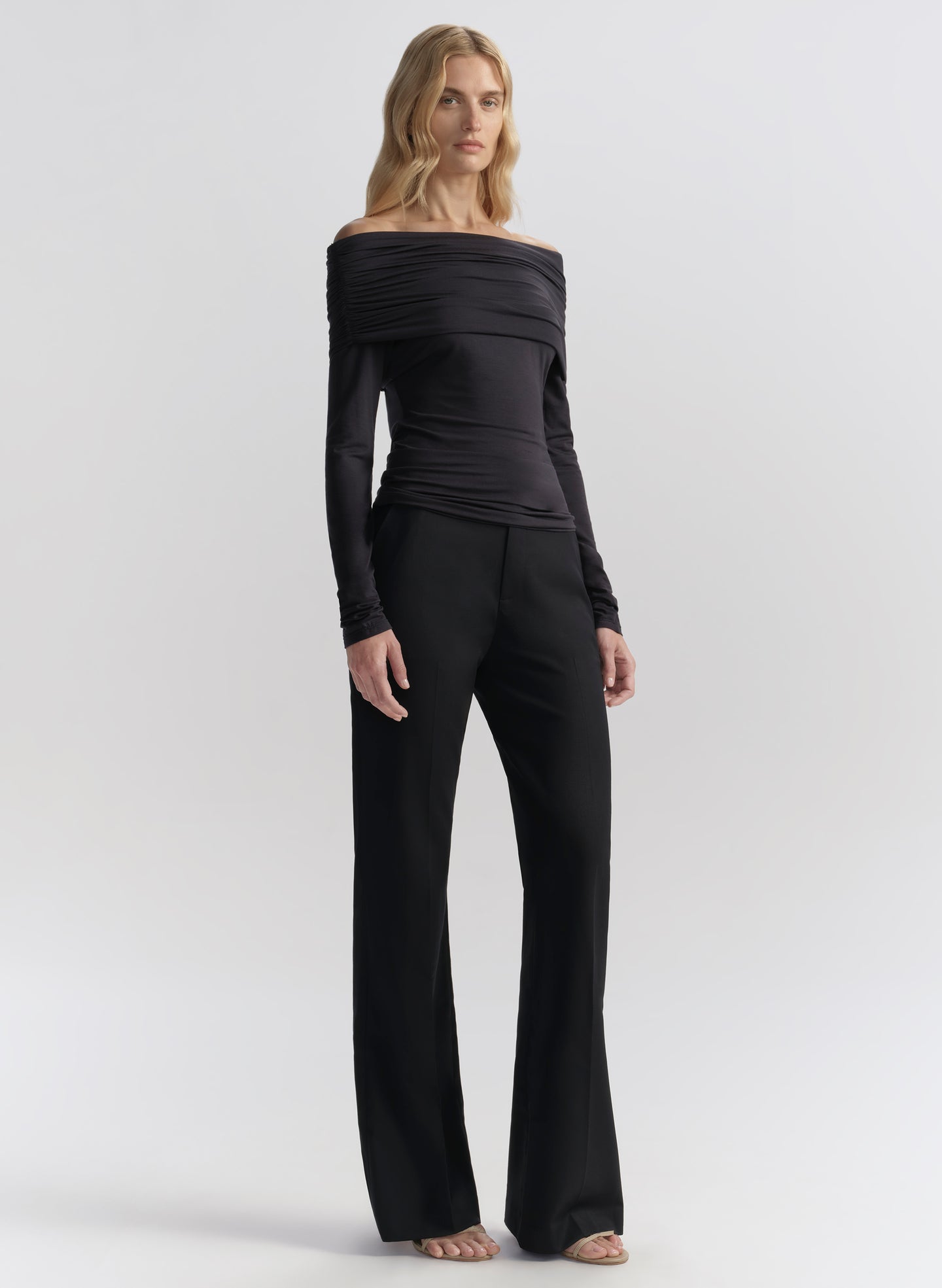 woman wearing dark blue off shoulder tee