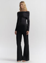 woman wearing dark blue off shoulder tee