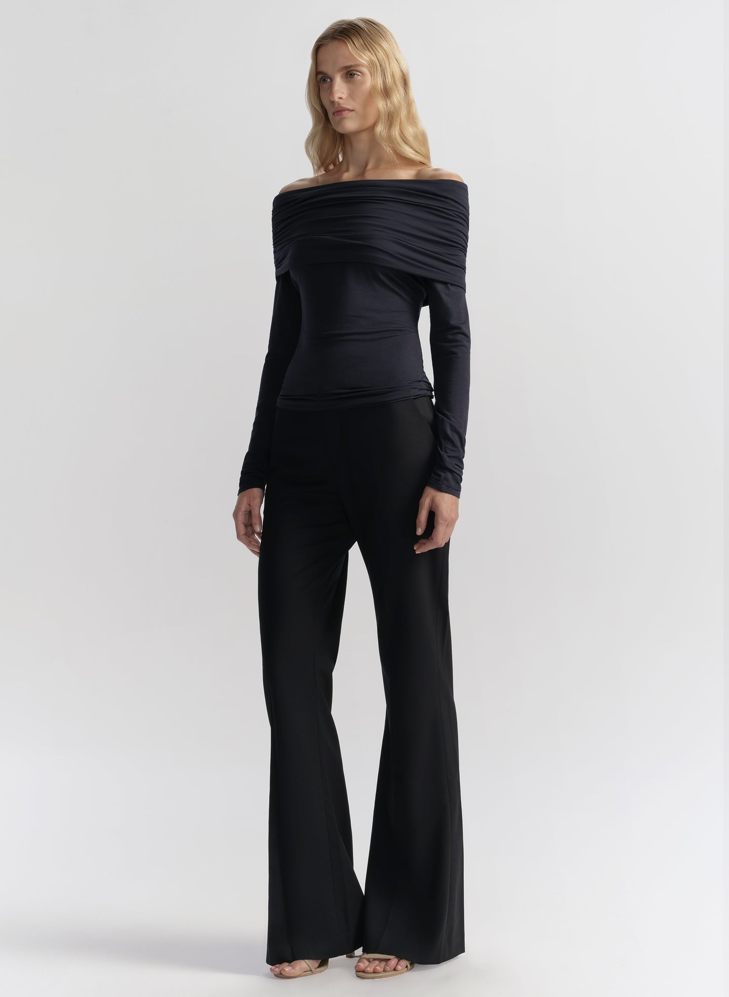 woman wearing navy off shoulder top and pants