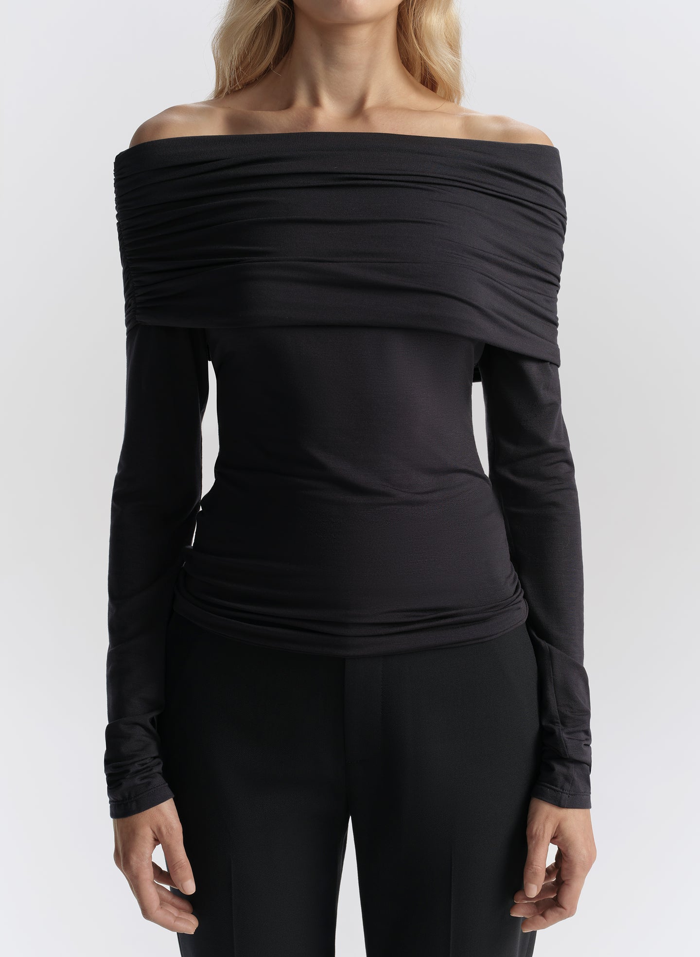 woman wearing dark blue off shoulder tee