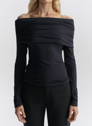 woman wearing navy off shoulder tee