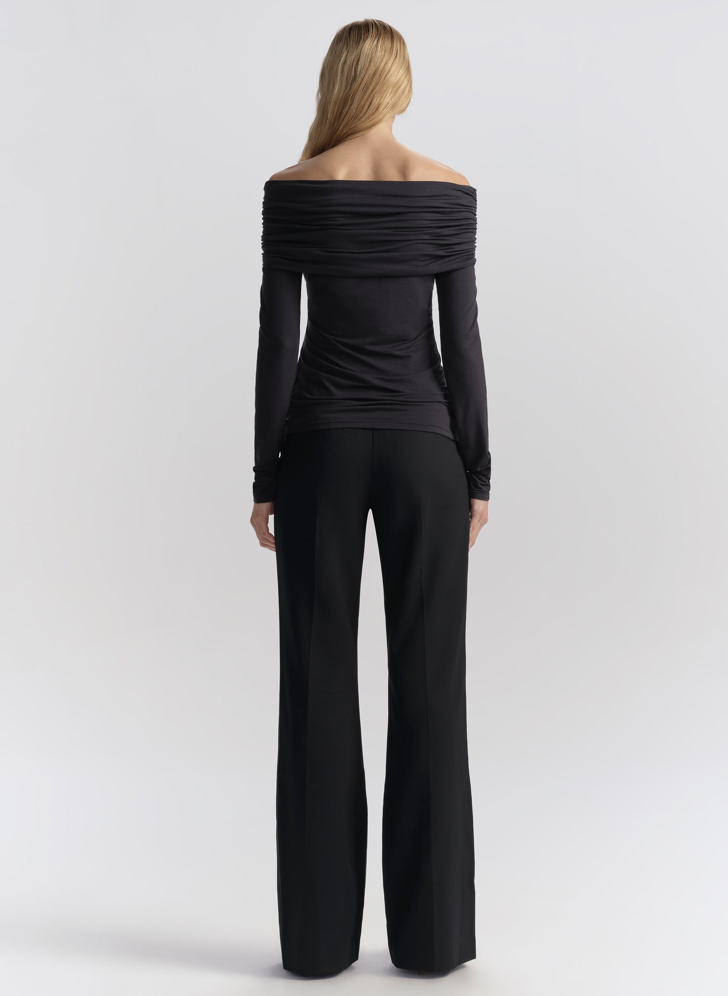 woman wearing dark blue off shoulder tee