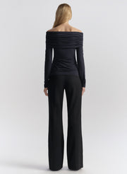 woman wearing off shoulder top and pants