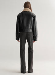 woman wearing faux leather and shearling jacket