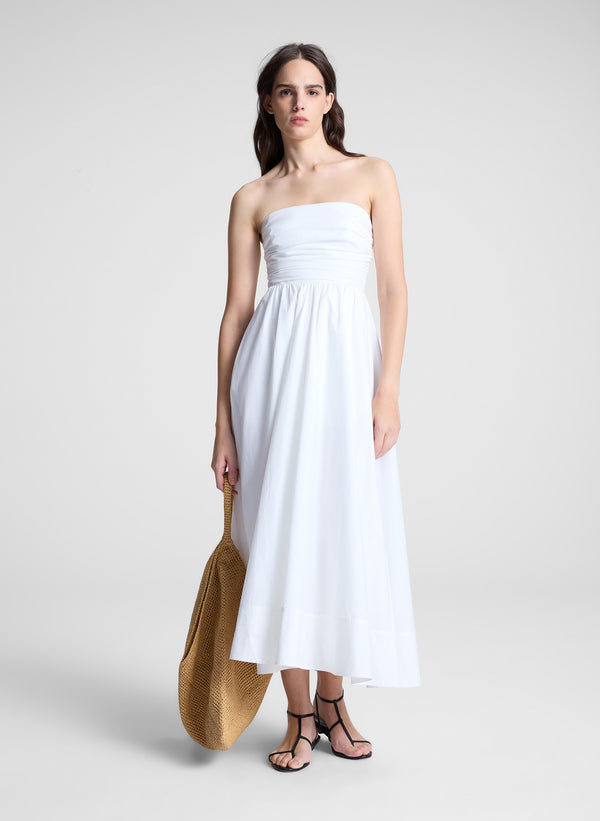 woman in white strapless midi dress