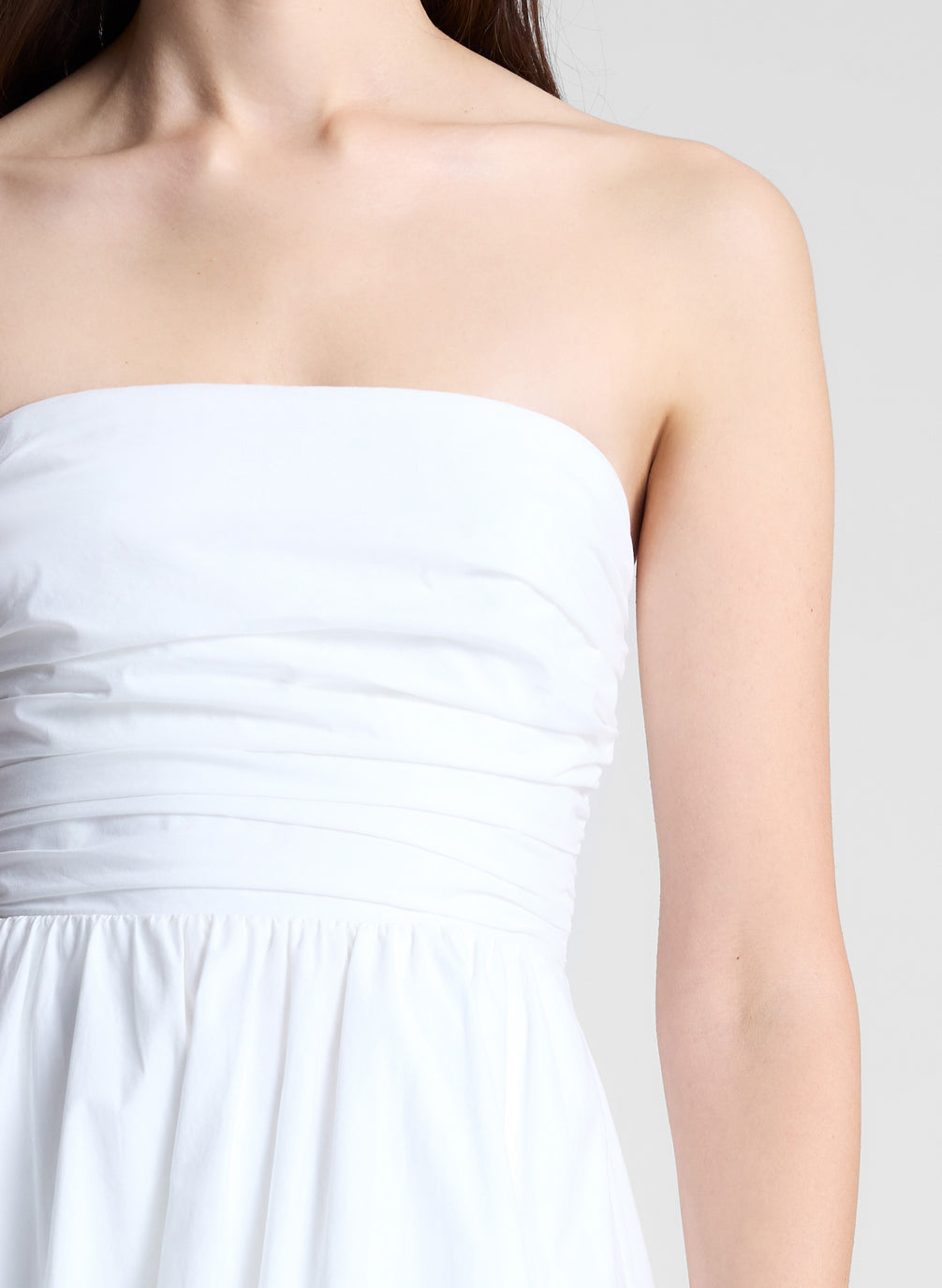 woman in white strapless midi dress