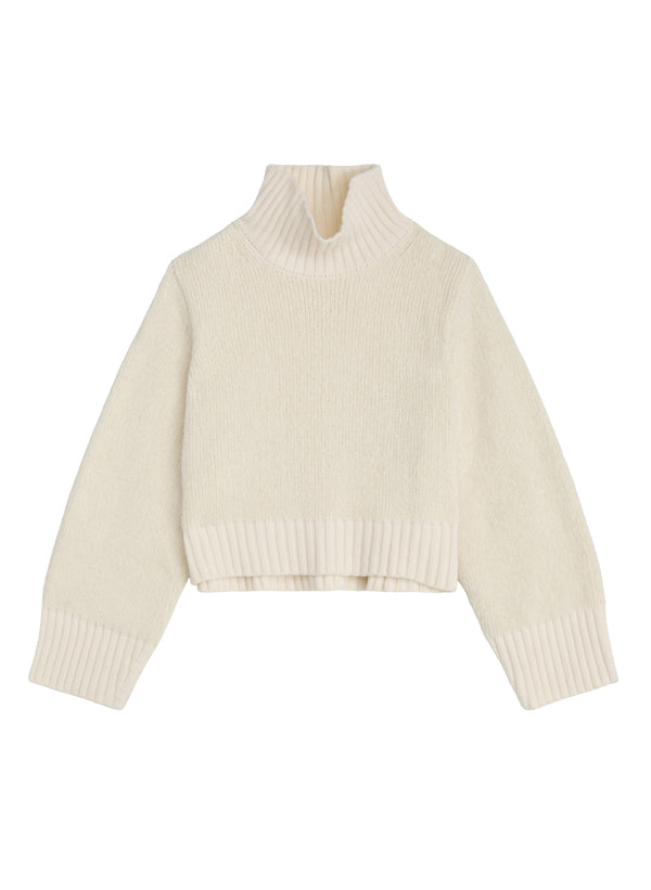 flatlay of white turtleneck sweater
