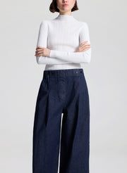 woman wearing white top and wide leg trouser jean