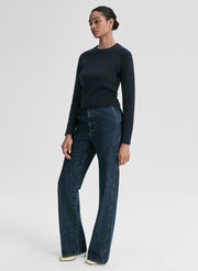woman wearing navy blue sweater and blue jeans