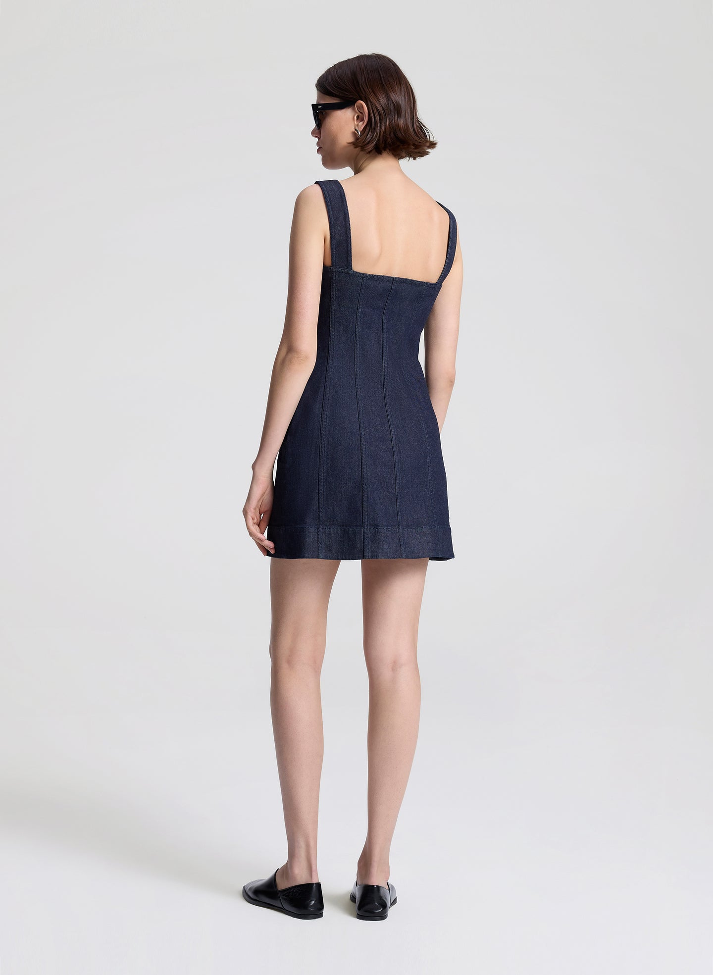 woman wearing denim mini dress