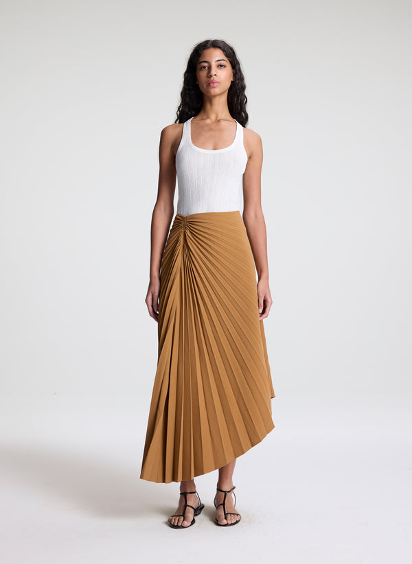 woman wearing khaki pleated midi skirt