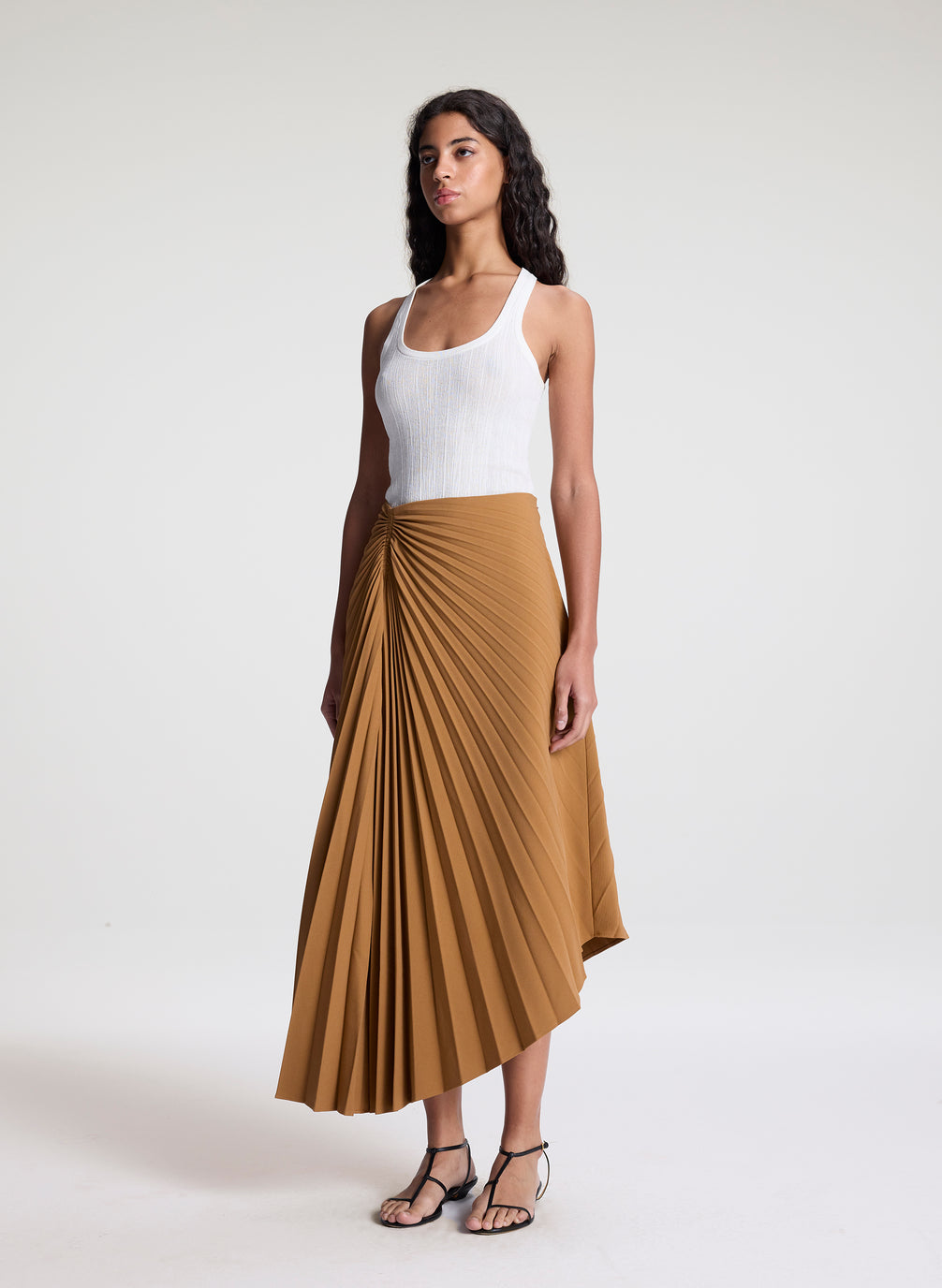 woman wearing khaki pleated midi skirt