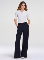 woman waring white top and navy pants