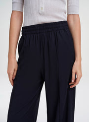 woman in navy blue pants