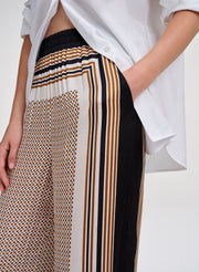 Patterned pants with a white shirt on a white background