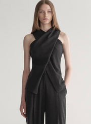 woman wearing a dark grey top and matching pants 