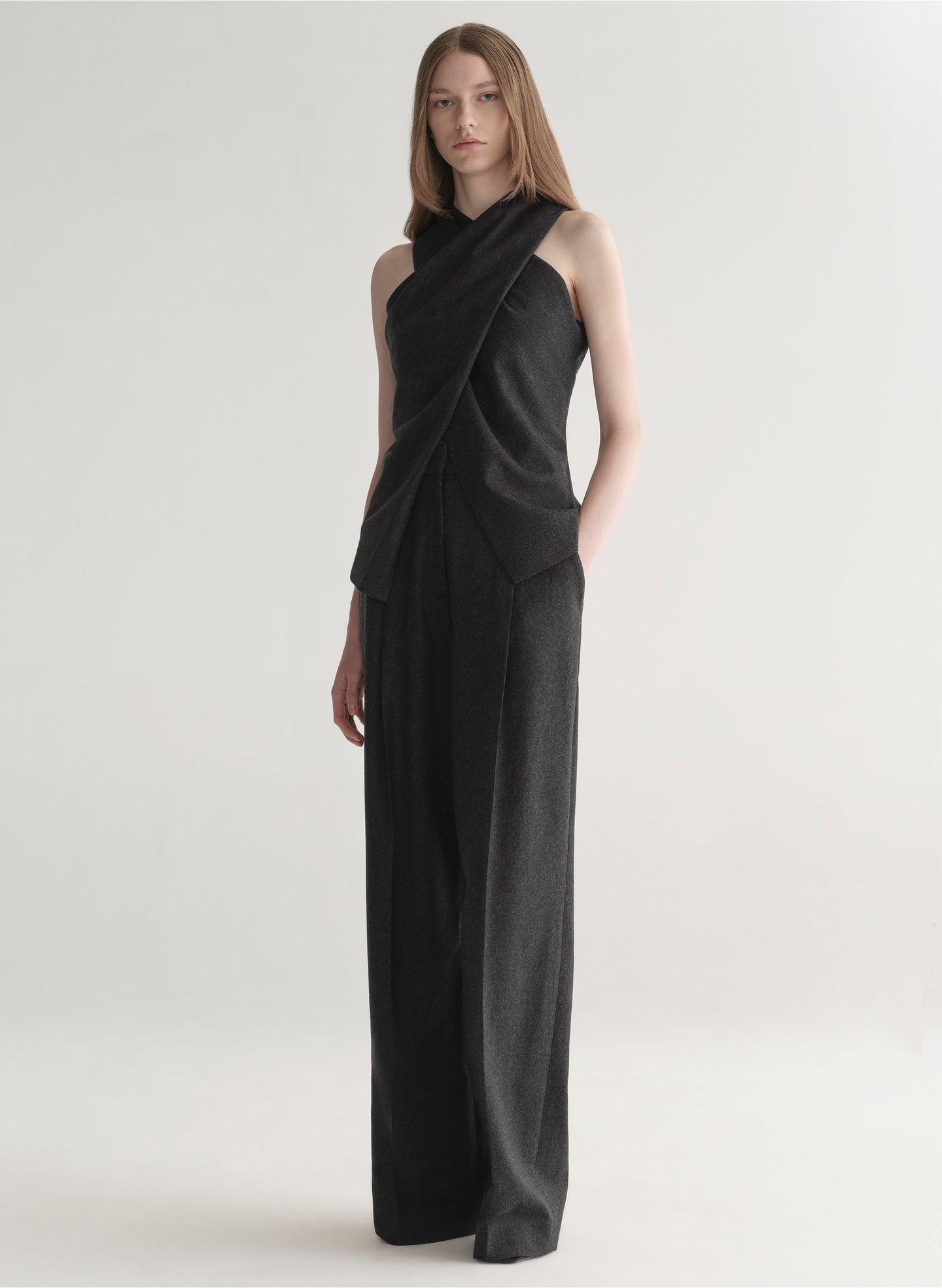 woman wearing a dark grey top and matching pants 