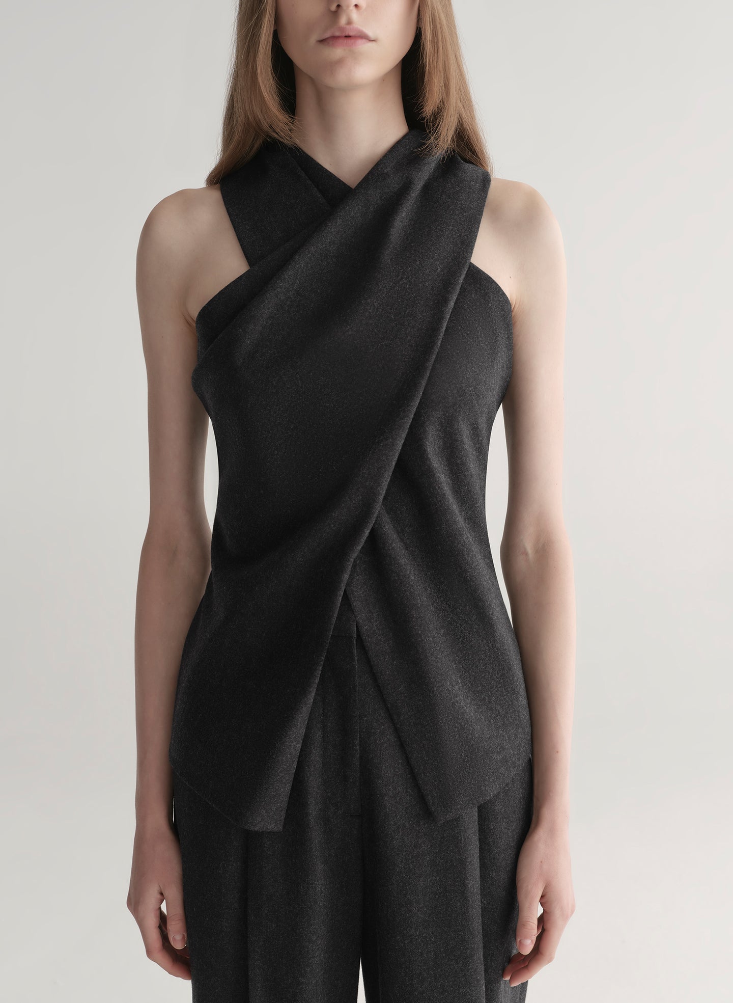 woman wearing a dark grey top and matching pants 